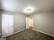 Comfortable bedroom with neutral walls, plush carpet, and closet space at 6635 Hidden Brook Trl, South Fulton, GA 30349