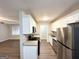 Galley kitchen with granite countertops and stainless steel appliances, perfect for cooking at 6635 Hidden Brook Trl, South Fulton, GA 30349