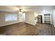 Open-concept living room with a view of the modern kitchen and stainless steel appliances at 6635 Hidden Brook Trl, South Fulton, GA 30349