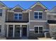 Charming two-story townhome showcasing a mix of brick and siding accents at 4841 Walkers Green, Mableton, GA 30126