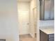 Hallway view next to the kitchen with cabinets and granite counters at 4841 Walkers Green, Mableton, GA 30126