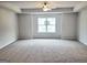 Spacious main bedroom featuring a ceiling fan and a large window at 4841 Walkers Green, Mableton, GA 30126
