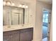 Bathroom with double vanity and modern fixtures with bright lighting at 4849 Walkers Green, Mableton, GA 30126