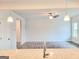 Open-concept living room with ceiling fan offers seamless flow at 4849 Walkers Green, Mableton, GA 30126