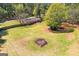 Aerial view of large lot featuring lush green grass and mature trees at 2079 Leguin Mill Rd, Locust Grove, GA 30248