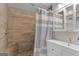 Bright bathroom features tile shower with bench seat and vanity with mirror at 2079 Leguin Mill Rd, Locust Grove, GA 30248