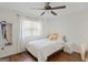 Bedroom features hardwood floors, ceiling fan and natural light at 2079 Leguin Mill Rd, Locust Grove, GA 30248