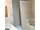 Bathroom featuring a tub and shower combination and decorative wall paper at 3221 Rock Creek Dr, Rex, GA 30273