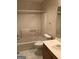 Bathroom with a standard tub/shower combo and neutral colored tile floor at 3221 Rock Creek Dr, Rex, GA 30273