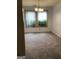 Bright dining room with large windows and neutral walls at 3221 Rock Creek Dr, Rex, GA 30273