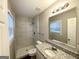 This bathroom has a tiled shower, a granite countertop, and a modern vanity mirror at 120 Gran De, Atlanta, GA 30349
