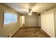 This carpeted bedroom features a ceiling fan, window, and a closet for storage at 120 Gran De, Atlanta, GA 30349