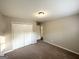 This carpeted bedroom features a closet and a neutral color scheme at 120 Gran De, Atlanta, GA 30349