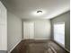 Bright bedroom features carpeted floors, a window with blinds, and a double door closet at 120 Gran De, Atlanta, GA 30349