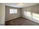 This bedroom features plush carpeting, a window for natural light, and neutral paint at 120 Gran De, Atlanta, GA 30349