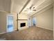 Spacious living room with painted brick fireplace, ceiling fan and access to the screened porch at 120 Gran De, Atlanta, GA 30349