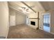 Living room featuring a fireplace, large windows, ceiling fan, and light gray walls at 120 Gran De, Atlanta, GA 30349