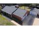 Brick home with a new roof, two-car garage, and detached one-car garage in a lush setting at 2533 Whispering Pines Dr, Grayson, GA 30017