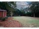 Expansive backyard showcasing lush greenery and mature trees, offering a serene outdoor space at 2533 Whispering Pines Dr, Grayson, GA 30017