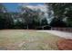 Expansive backyard featuring a carport and lush green lawn, ideal for outdoor activities and relaxation at 2533 Whispering Pines Dr, Grayson, GA 30017