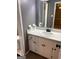 Bathroom featuring a white vanity with sink, large mirror, and access to the toilet area at 2533 Whispering Pines Dr, Grayson, GA 30017