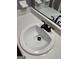 Modern bathroom vanity sink with black faucet and hardware, soap dish, and mirror at 2533 Whispering Pines Dr, Grayson, GA 30017