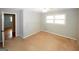 Bedroom featuring neutral walls, carpet, and an open doorway to adjacent living space at 2533 Whispering Pines Dr, Grayson, GA 30017