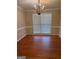 Dining room featuring wood floors, chandelier, and double windows for natural light at 2533 Whispering Pines Dr, Grayson, GA 30017