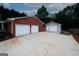 Detached two-car brick garage and separate one-car garage with ample parking space at 2533 Whispering Pines Dr, Grayson, GA 30017