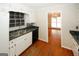 Functional kitchen with black appliances and ample counter space, leading to a large dining area at 2533 Whispering Pines Dr, Grayson, GA 30017