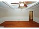 Spacious living area featuring hardwood floors, classic trim, and a modern ceiling fan at 2533 Whispering Pines Dr, Grayson, GA 30017