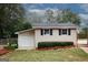One-car detached garage surrounded by lawn and landscaping at 2533 Whispering Pines Dr, Grayson, GA 30017