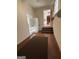 A view of the functional utility room with tiled floors, storage cabinets, and access to the backyard at 2533 Whispering Pines Dr, Grayson, GA 30017