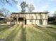 Back exterior elevation showing a deck, patio and grassy yard at 2786 Altaview Se Dr, Atlanta, GA 30354
