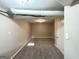 Unfinished basement with neutral walls and carpet and access door at 2786 Altaview Se Dr, Atlanta, GA 30354