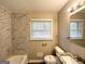 Bright bathroom featuring tub, neutral paint, window, and updated vanity at 2786 Altaview Se Dr, Atlanta, GA 30354
