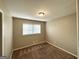 Neutral bedroom featuring carpeted floors, a window, and a closet for storage at 2786 Altaview Se Dr, Atlanta, GA 30354