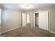Neutral bedroom showcasing carpet, closet, and lots of natural light at 2786 Altaview Se Dr, Atlanta, GA 30354