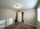Comfortable bedroom with carpeted floors, closet, and a neutral color scheme for versatile decor options at 2786 Altaview Se Dr, Atlanta, GA 30354
