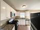 Bright kitchen with stainless steel appliances, white cabinets, and granite countertops, with wood flooring at 2786 Altaview Se Dr, Atlanta, GA 30354