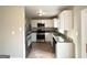 Modern kitchen with white cabinets, stainless steel appliances, and granite countertops at 2786 Altaview Se Dr, Atlanta, GA 30354