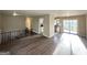 Spacious living room with wood floors, access to the kitchen, and sliding doors to a deck at 2786 Altaview Se Dr, Atlanta, GA 30354
