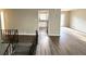 Open concept living area featuring wood floors, stairs to a lower level, and a view into the kitchen at 2786 Altaview Se Dr, Atlanta, GA 30354