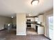 Bright living room featuring wood floors and an open layout connecting the kitchen and outdoor deck at 2786 Altaview Se Dr, Atlanta, GA 30354