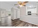Open-concept living space with hardwood floors, kitchen, and access to dining room at 4 Bonnie Glen Ln, Hampton, GA 30228
