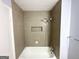 This updated bathroom features a tiled shower-tub, and shower caddy at 2087 John Wesley Ct, Decatur, GA 30035