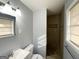 Nicely updated bathroom features tile shower, vanity, and neutral color palette at 2087 John Wesley Ct, Decatur, GA 30035