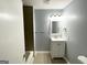 This bathroom features updated vanity, a tub and shower combination, and tile flooring at 2087 John Wesley Ct, Decatur, GA 30035