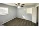 This bedroom features gray walls, two windows for ample light, and an updated ceiling fan at 2087 John Wesley Ct, Decatur, GA 30035