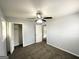 The bedroom offers a modern ceiling fan, neutral walls and carpet, and closet space at 2087 John Wesley Ct, Decatur, GA 30035